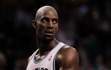 Boston Celtics' Kevin Garnett looks over his shoulder as the Philadelphia 76ers prepare to shoot a foul shot during the final moments of the fourth quarter of Game 2 of their NBA Eastern Conference semi-finals playoff basketball series in Boston